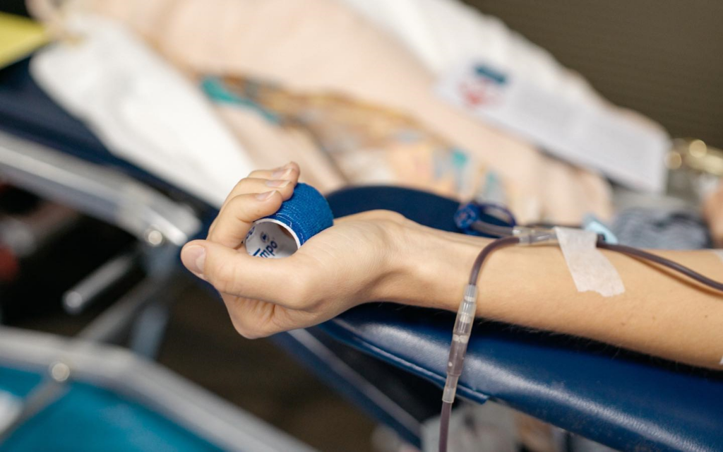 Photo of donor's left arm during blood donation process